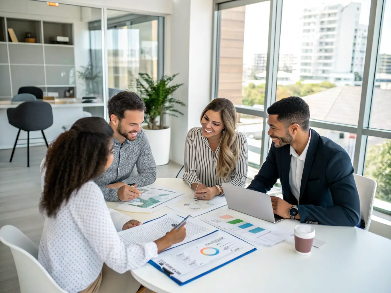A professional team analyzing real estate assets on digital screens in a modern office, representing asset management.